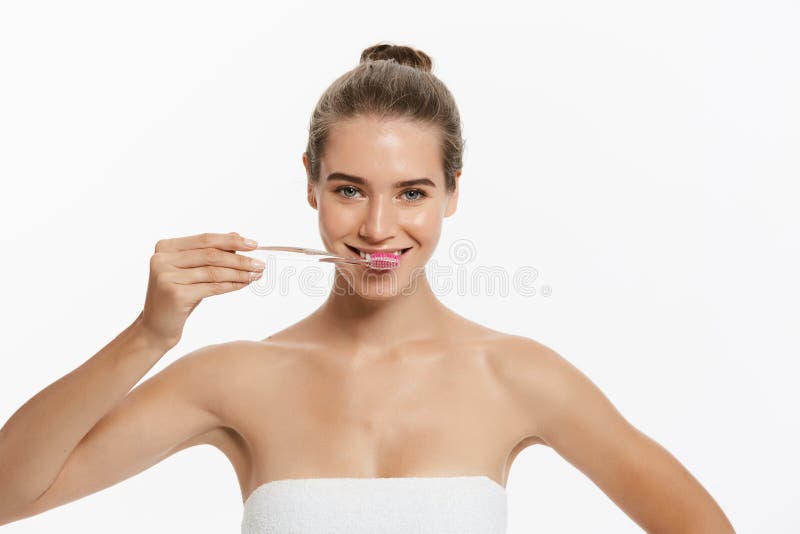 Beauty Portrait Of A Happy Beautiful Half Naked Woman Brushing Her