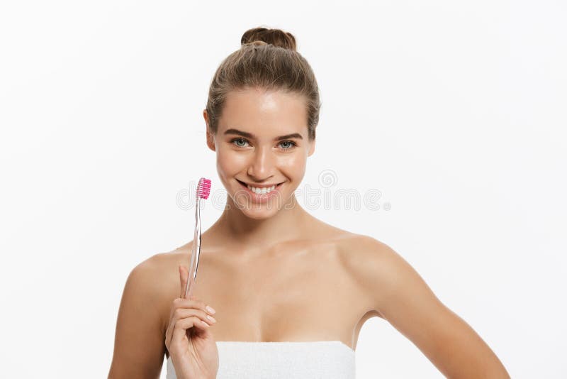 Beauty Portrait Of A Happy Beautiful Half Naked Woman Brushing Her