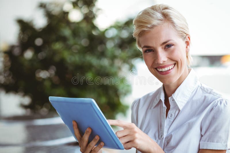 A Happy Pretty Blonde Using Tablet Computer Stock Image Image Of Cafe Computer