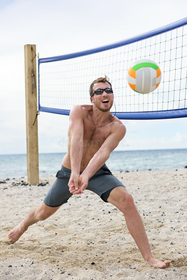 Man Playing Beach Volleyball Game Hitting Ball Stock Photo Image Of