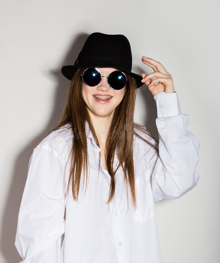 Naked Girl In A Man S White Shirt Sunglasses And Black Hat Stock Photo