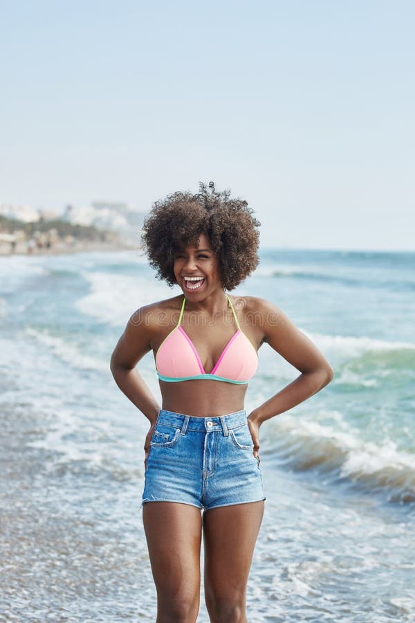 Pretty Afro American Girl In Yellow Bikini Laughing Looking Away Stock