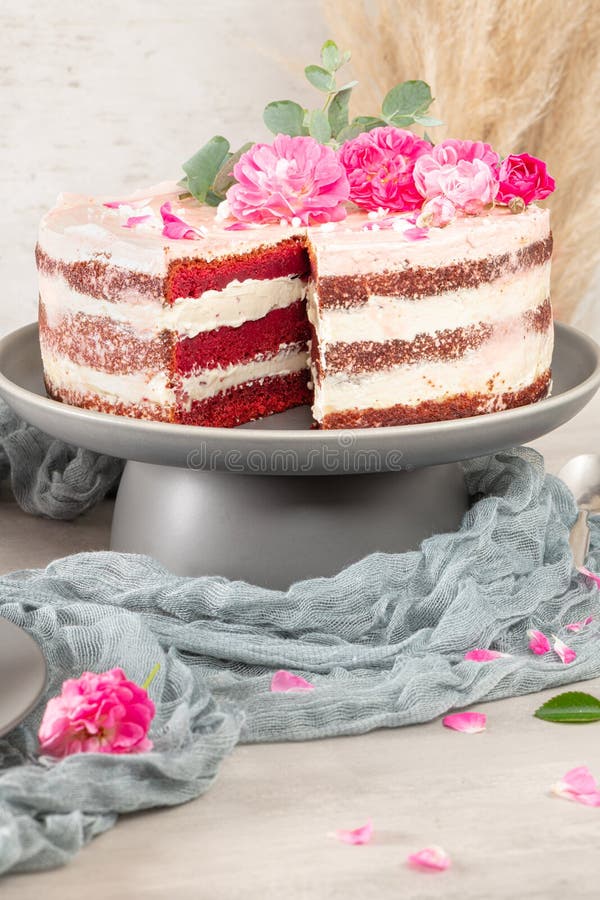 Red Velvet Naked Cake With Fresh Roses And Swiss Buttercream On Kitchen