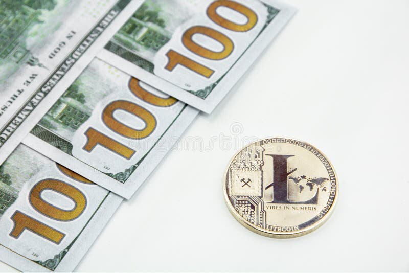 Silver litecoin and 100 dollars royalty free stock photo