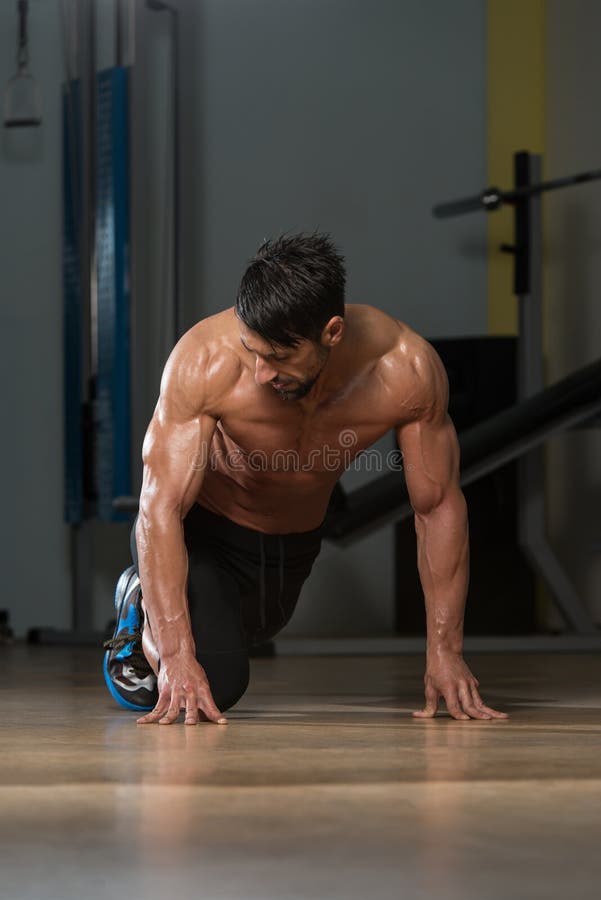 Strong Muscular Men Kneeling On The Floor Stock Image Image Of