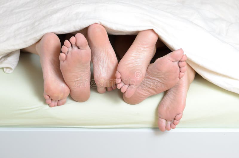 Three Pairs Of Feet In Bed Stock Image Image Of Sleeping 56246105