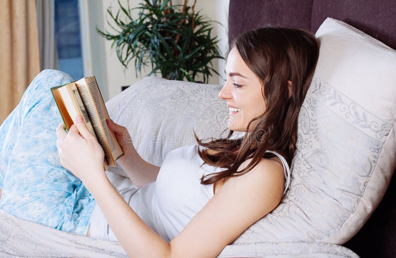 Portrait Of Beautiful Happy Woman Reading Magazine Stock Image Image