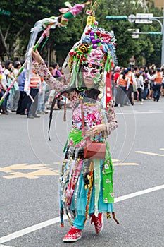 Costumed revelers march with floats in the annual Dream Parade o