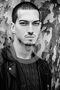 Man portrait outdoors. Handsome natural male. Black and white