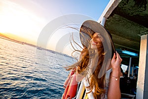 Woman enjoying the sea from ferry boat" border="0