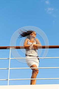 Woman enjoying sunset cruise" border="0