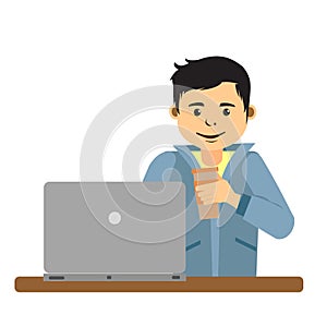 Young man working on internet using laptop and drinking coffee
