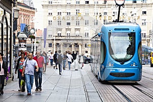 Zagreb, Croatia. Street crowd and tram