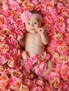 Baby in a bed of roses