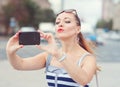Beautiful woman taken picture of herself in the city