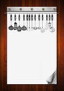 Blank notebook with kitchen utensils pages and for recipes or menu on wooden wall Stock Photos