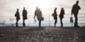Blurred People Standing In Bri...