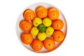 Bowl of citrus fruits isolated on a white