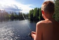 Boy Fishing At A Lake