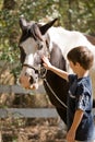 Boy Petting Horse