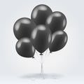 Bunch of black glossy inflatable balloons over light background Royalty Free Stock Image
