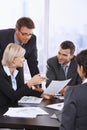 Business People Reviewing Cont...