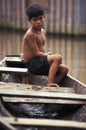 Child on canoe in the Amazon, Brazil.