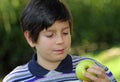 Child watch an apple before eating