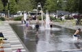 Children playing in Klyde Warren park fountain