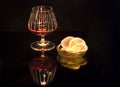 Cognac with lemon reflected