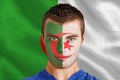 Composite image of serious young algeria fan with facepaint