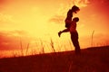 Couple Embracing At Sunset