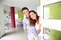Couple Welcoming People At Home