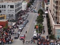 Crowd of people walk along sidewalk towards World Series game