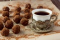 Cup of turkish coffee and homemade truffle balls