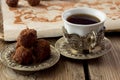 Cup of turkish coffee and homemade truffle balls