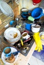 Dirty kitchen pile unwashed dishes Royalty Free Stock Images