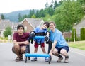 Disabled boy in walker, with father and brother