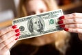 Dollar In Front Of Face