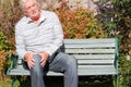 Elderly man in discomfort with a knee. Arthritis.