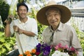 Elderly Man With Son In Garden