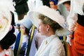 Elegant woman sits and watches the performance.