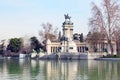 Equestrian monument to Alfonso XII reflected in pond