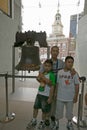 Family stands in front of Liberty Bell