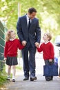 Father Walking To School With ...