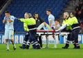Football player reacts after teammate injury during UEFA Champions League game