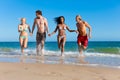 Friends Running On Beach Vacat...