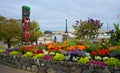 Garden and totem on the banks of Victoria Inner Harbour, British Columbia, Canada