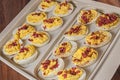 Garnished deviled eggs,container,cutting board