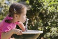 Girl Drinking From Water Fount...